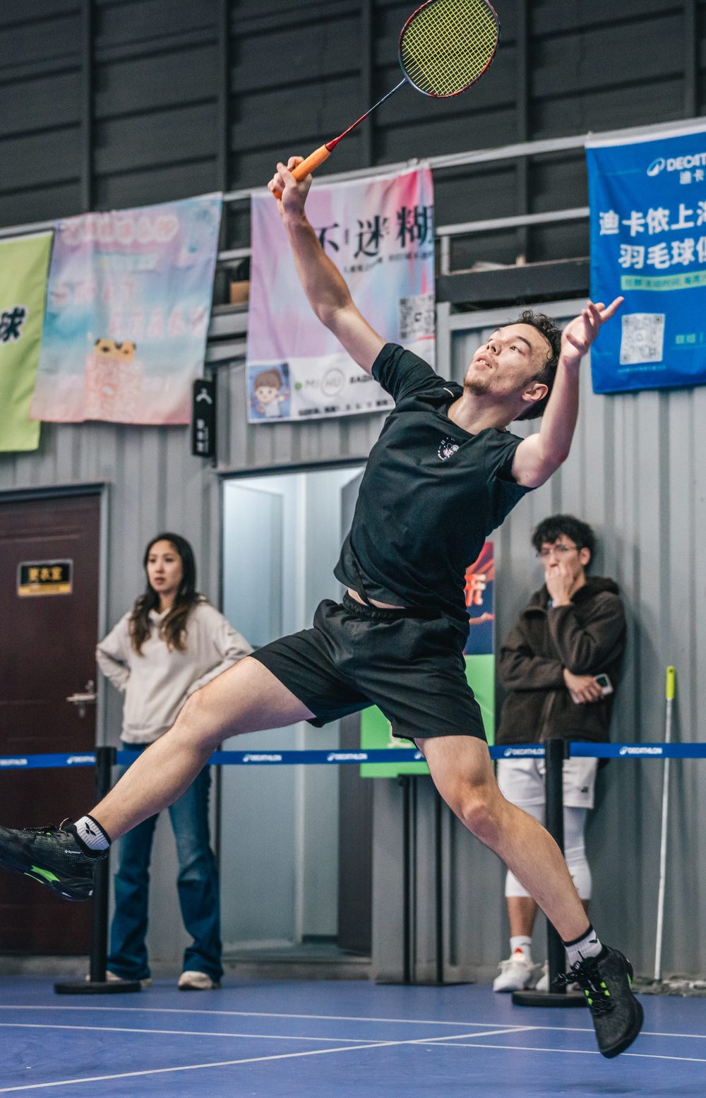Louis playing badminton in China
